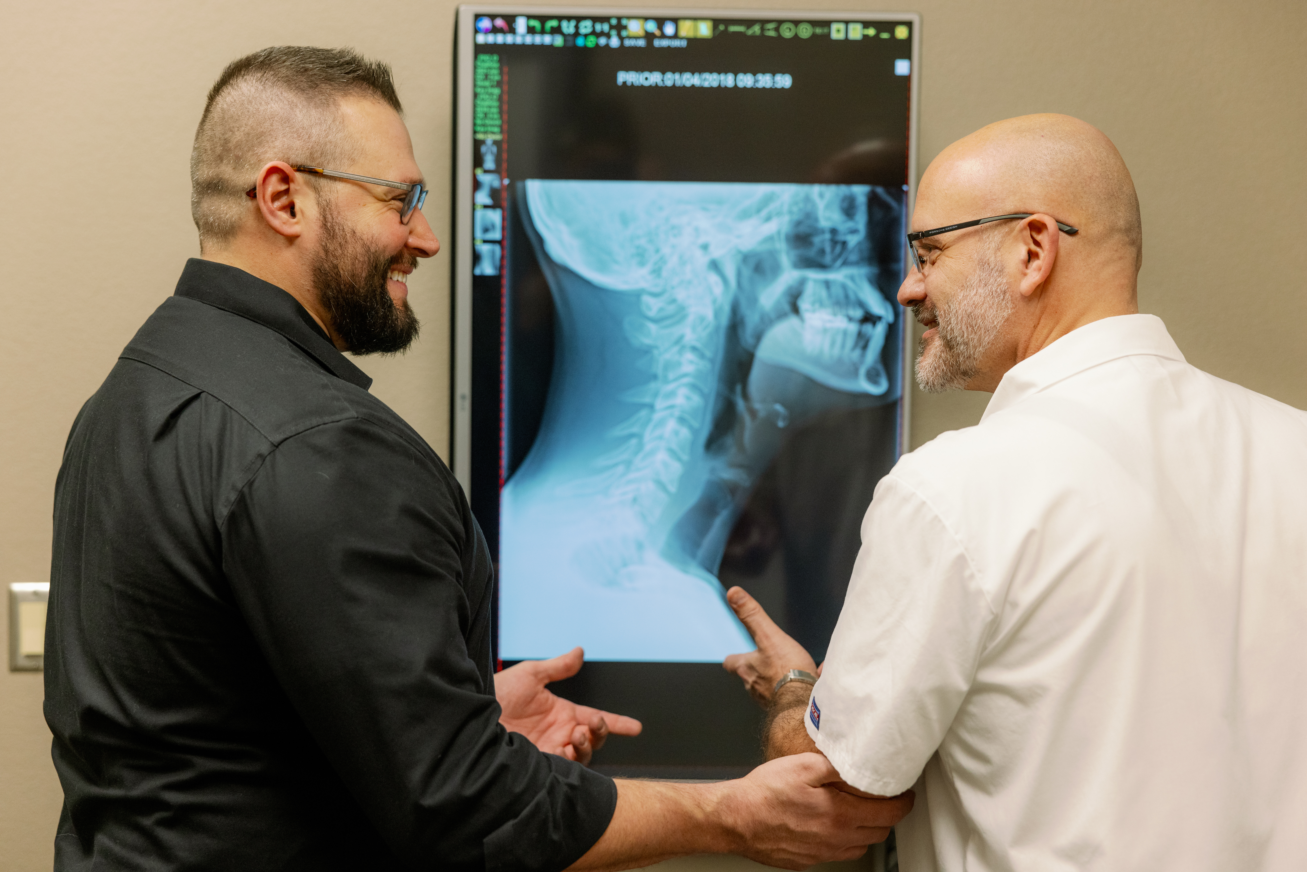 Chiropractor helping a patient with exercises